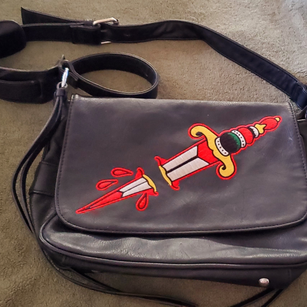 Sourpuss Black Crossbody Bag with Red Dagger Design